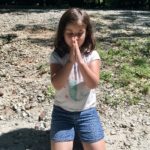 Abby meditates, saying “Om”